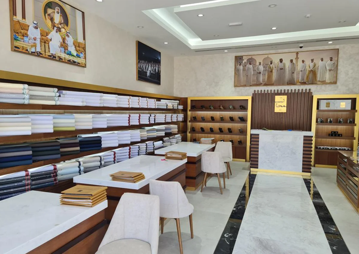 Retail interior with wall displays, timber shelving and central counters